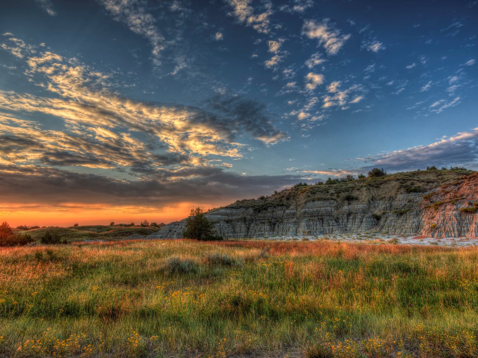 Sunset over prairie and buttes in western North Dakota